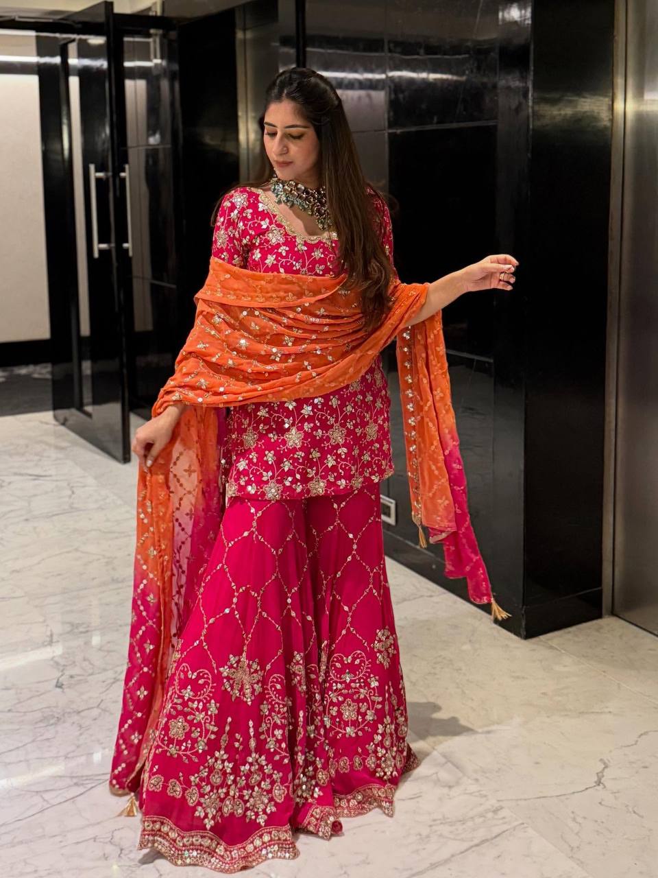 Radiant Elegance in Pink Attire - Image 2